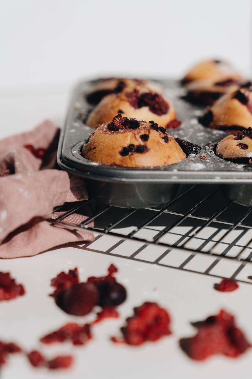selective focus of baked muffins in a muffin tin